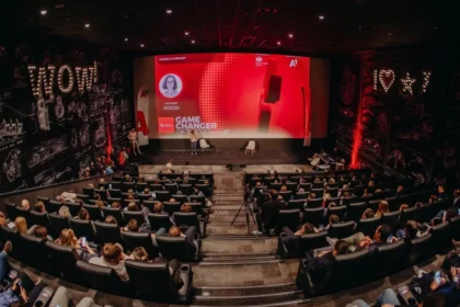 Opening ceremony of Game Changer Zagreb 5.0 at CineStar cinemas in Z Centar with a packed audience facing a red stage screen